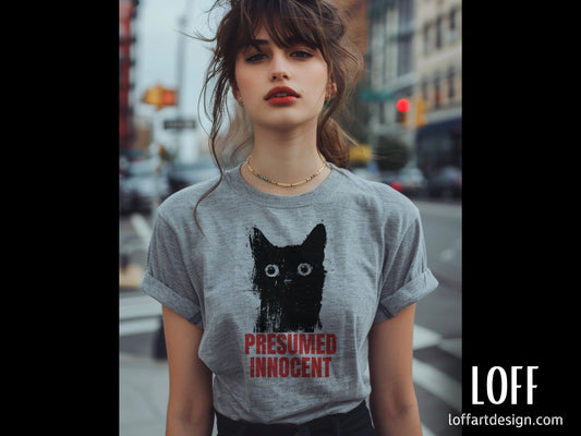 Illustration of a cat with the text “Presumed Innocent” in bold red letters, printed on a high-quality t-shirt